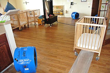 Dehumidifiers and layflats were set up at a day care to properly perform water extraction after a flood occurred causing water damage.