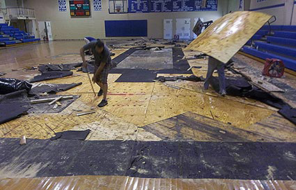 Dalworth technicians removing gym flooring
