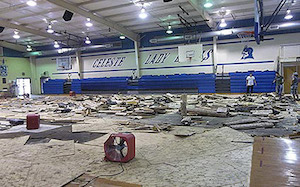 Water damaged flooring in a school's gym